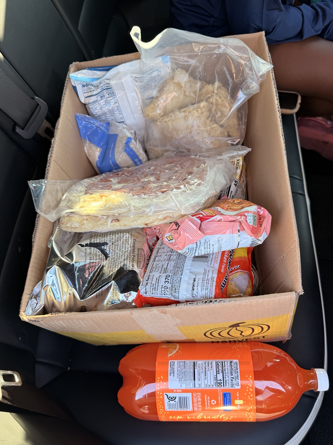A packed grocery box in the delivery vehicle